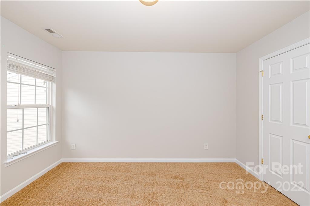 3329 Burnage Hall Road Harrisburg, NC 28075 - Photo 35 of 47 an empty room with windows
