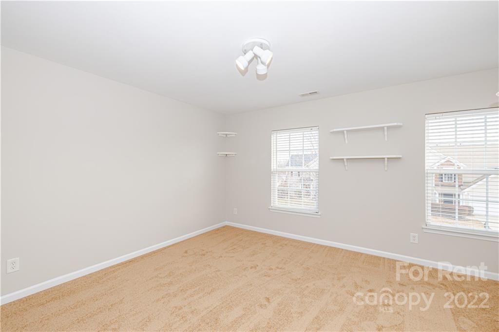3329 Burnage Hall Road Harrisburg, NC 28075 - Photo 36 of 47 a view of an empty room with a window