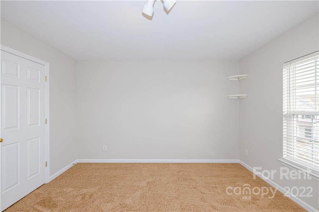3329 Burnage Hall Road Harrisburg, NC 28075 - Photo 39 of 47 an empty room with windows