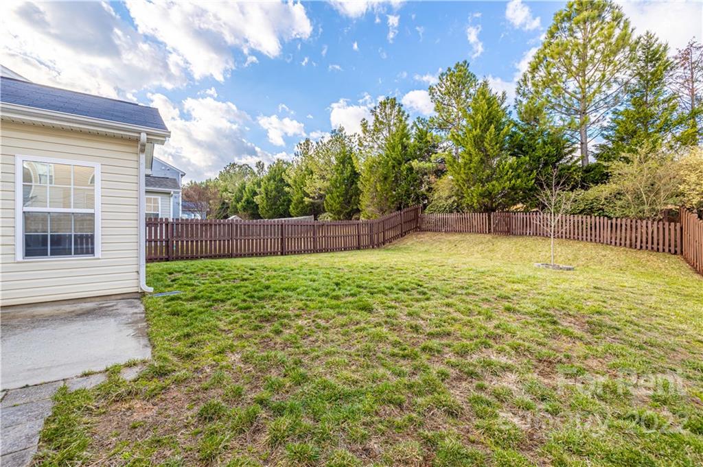 3329 Burnage Hall Road Harrisburg, NC 28075 - Photo 40 of 47 a view of a backyard