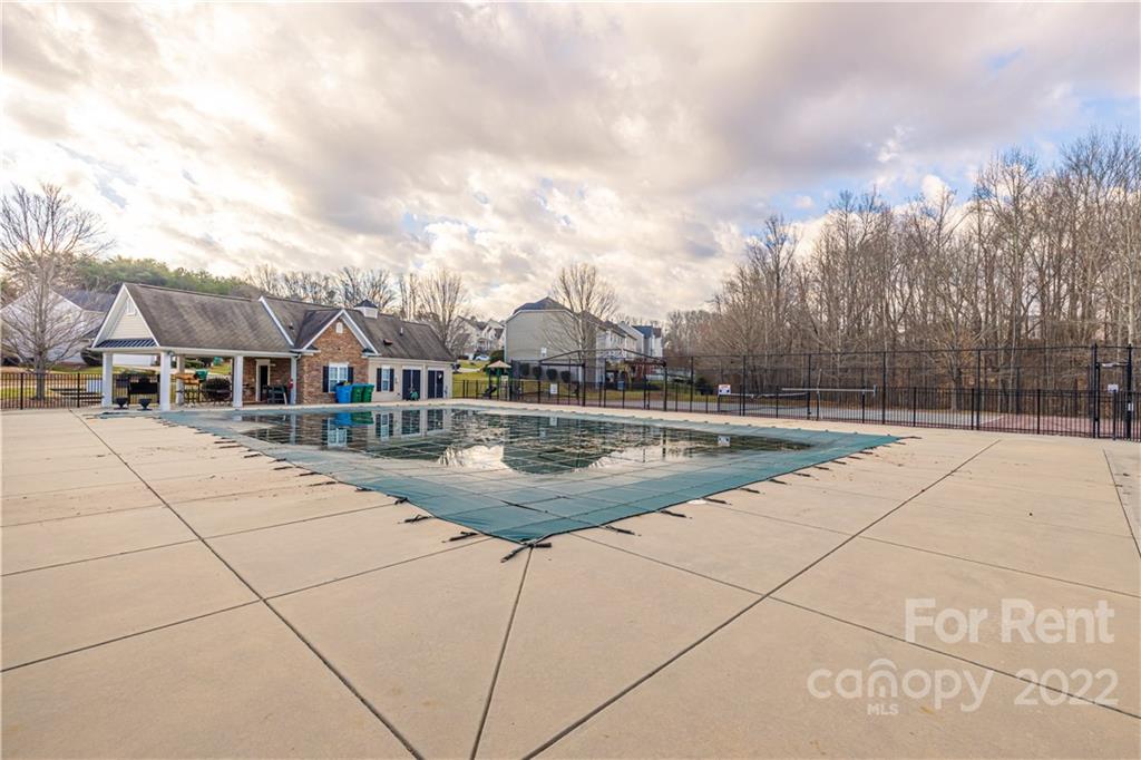3329 Burnage Hall Road Harrisburg, NC 28075 - Photo 45 of 47 a view of house with swimming pool and sitting area