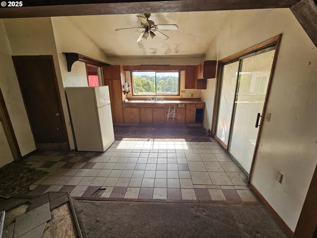 a view of entryway with a window and stairs