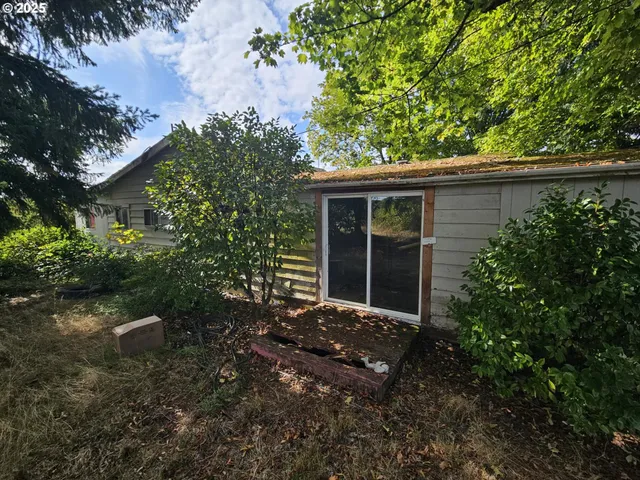 a backyard of a house with lots of green space