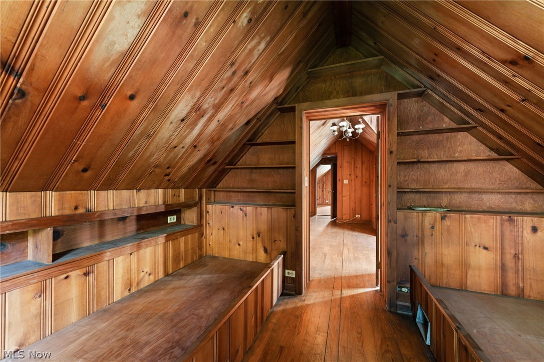 32601 Eddy Road Willoughby, OH 44094 - Photo 16 of 22 Attic room featuring sloped, tongue-and-groove wood paneling on walls and ceiling