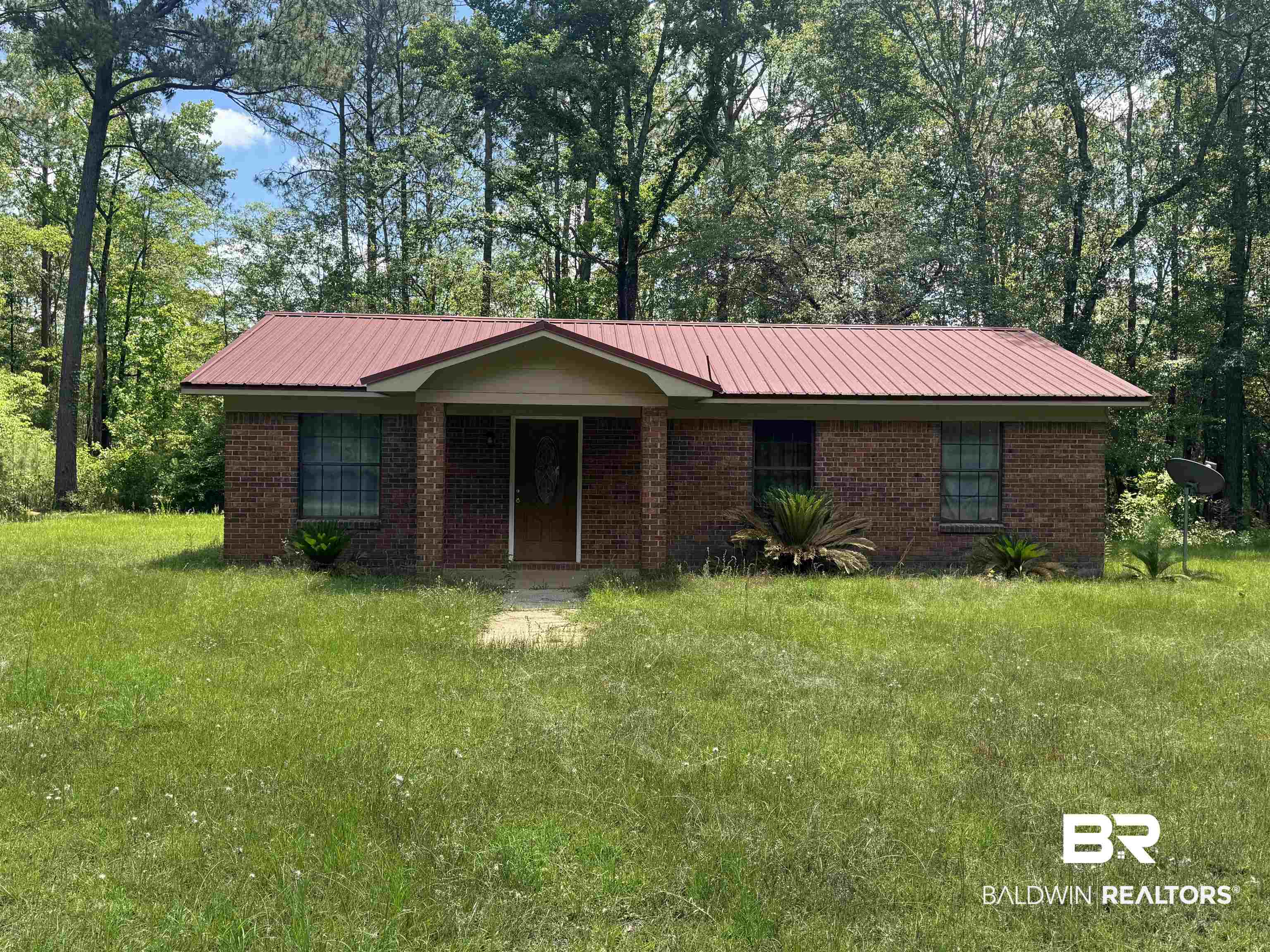 258 Johnson And Spotts Road Deer Park, AL 36529 - Photo 1 of 14 Single story home with metal roof, brick siding, and a front yard