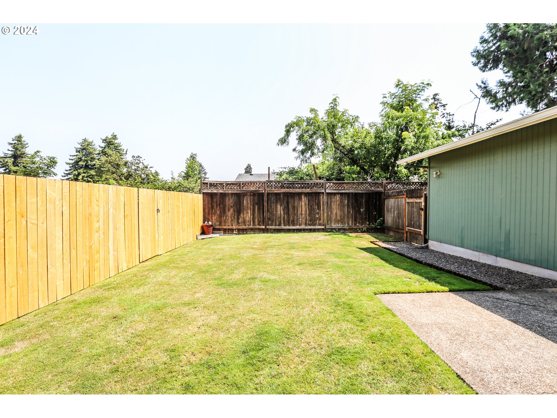 746 53rd Place Springfield, OR 97478 - Photo 5 of 20 a swimming pool with trees in the background