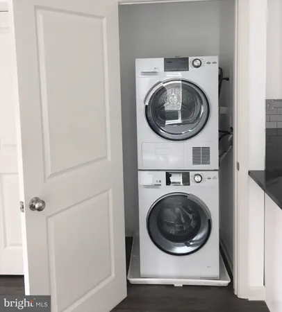 a view of a hallway with washer and dryer