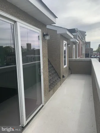 a lobby with furniture and floor to ceiling window