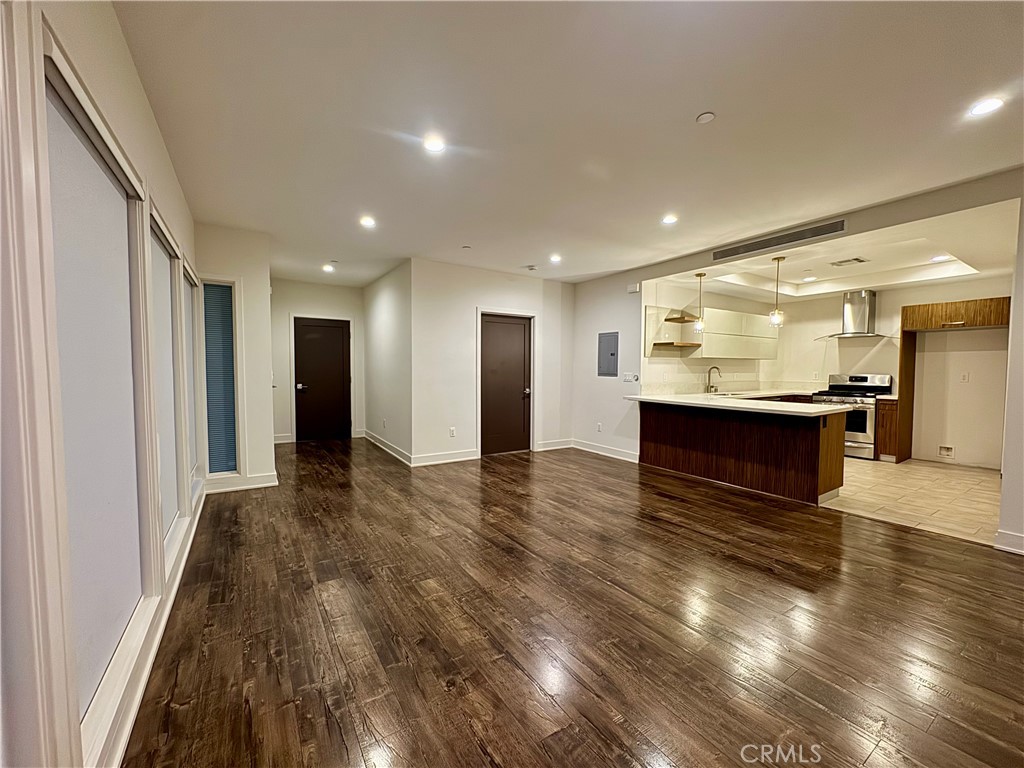 2428 East Del Mar Boulevard, Unit 101 Pasadena, CA 91107 - Photo 14 of 19 a view of kitchen with stainless steel appliances granite countertop a refrigerator and a stove