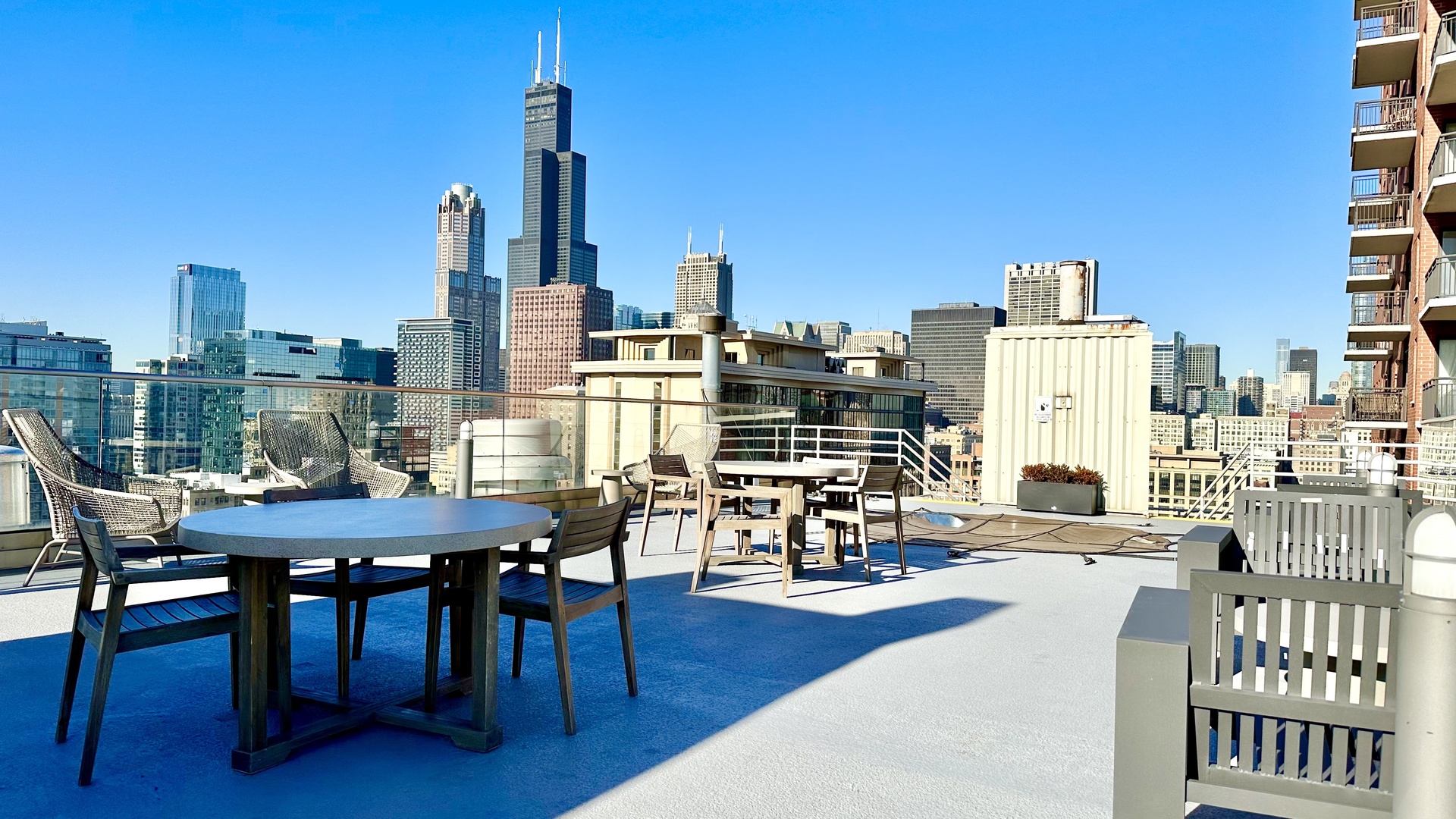 40 East 9th Street, Unit 402 Chicago, IL 60605 - Photo 15 of 24 a view of a city from a dining room with chairs