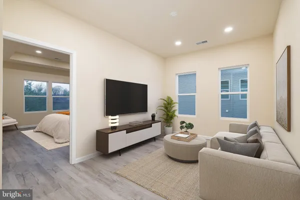 a bedroom with bed and a large window