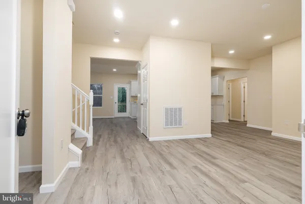 a view of entryway with wooden floor