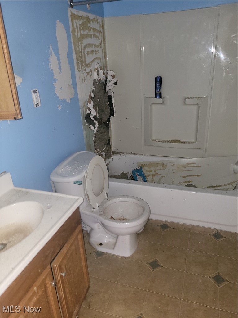 3201 East 118th Street Cleveland, OH 44120 - Photo 4 of 13 Bathroom with tile patterned flooring, toilet, and vanity