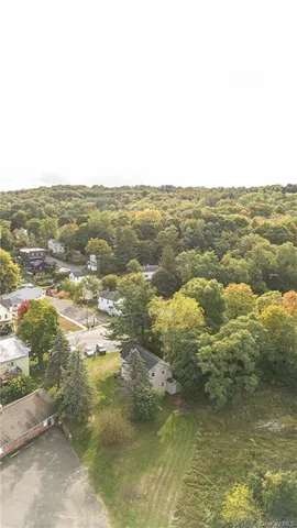 an aerial view of houses with yard