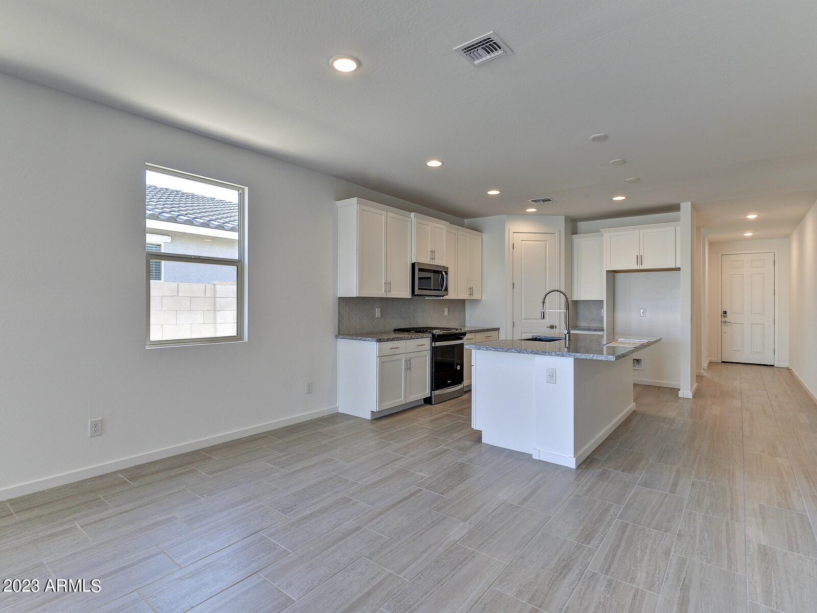 17368 West Red Fox Road Surprise, AZ 85387 - Photo 8 of 26 008_DiningKitchen