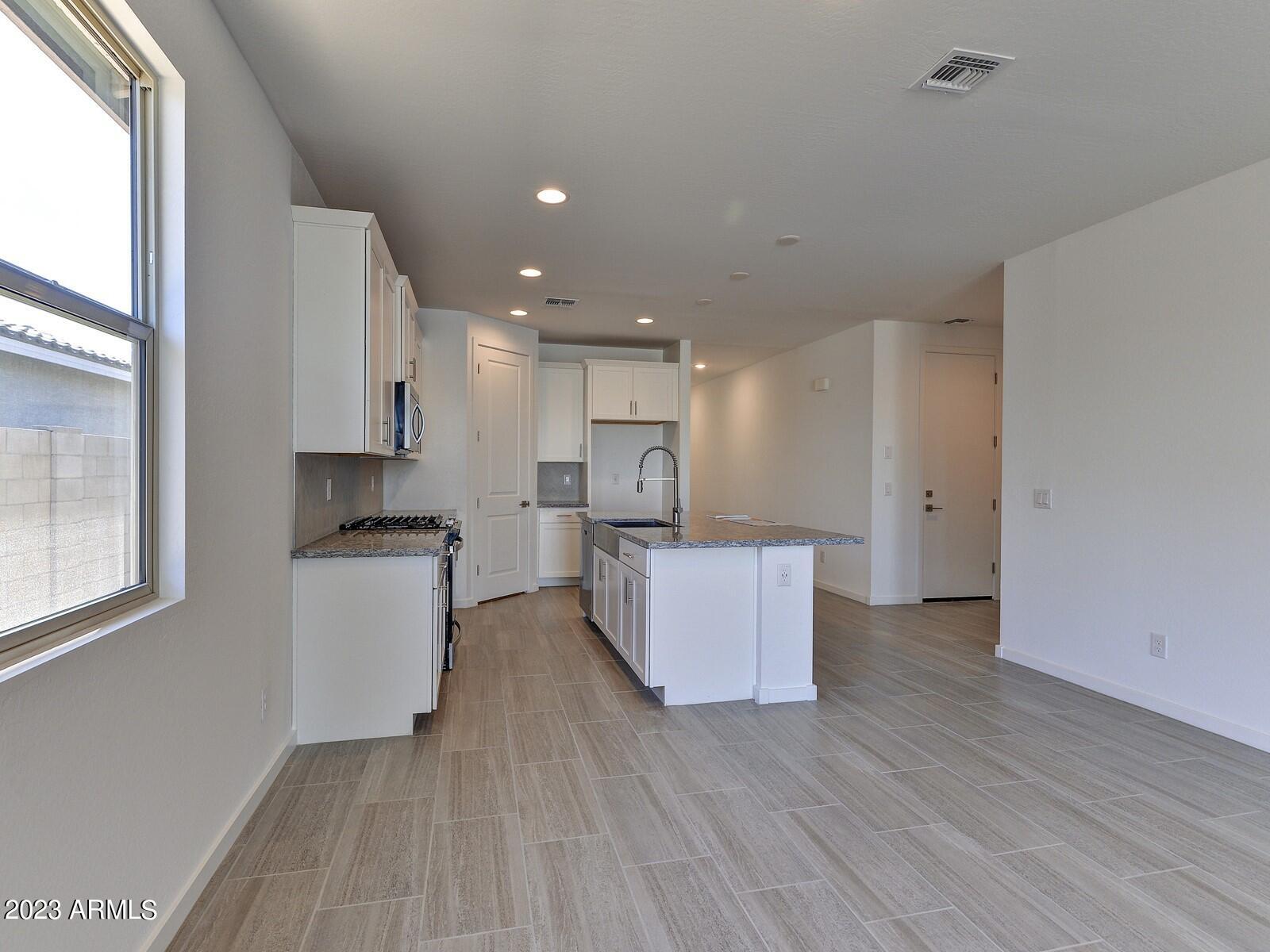17368 West Red Fox Road Surprise, AZ 85387 - Photo 9 of 26 009_DiningKitchen