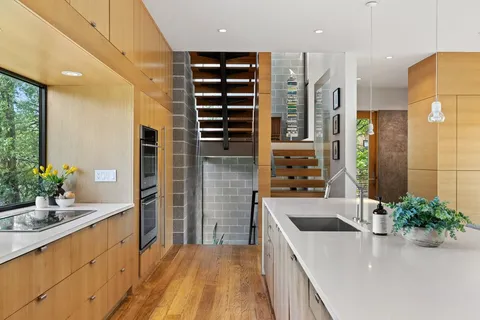 a kitchen with a sink and stove