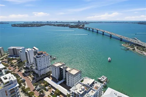 an aerial view of a house with a ocean view