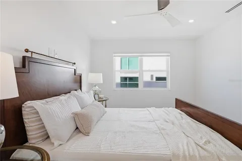 a bathroom with a toilet sink a mirror and shower