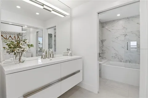 a bathroom with a sink and mirror
