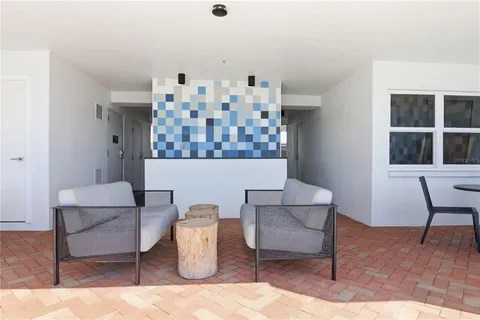 a view of roof deck with two chairs and wooden floor