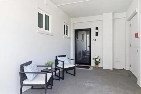 a view of a livingroom with furniture and a window