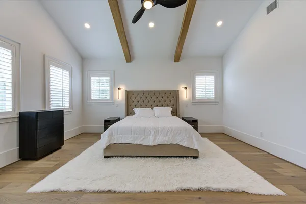 a bedroom with a bed and window
