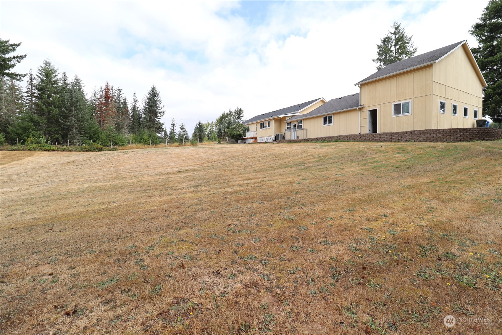 128 Aylesworth Road, Unit 4 Chehalis, WA 98532 - Photo 2 of 24 a view of a house with backyard and trees