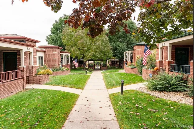 a view of a house with a yard porch and sitting area
