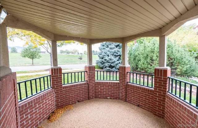 a view of a porch with wooden floor