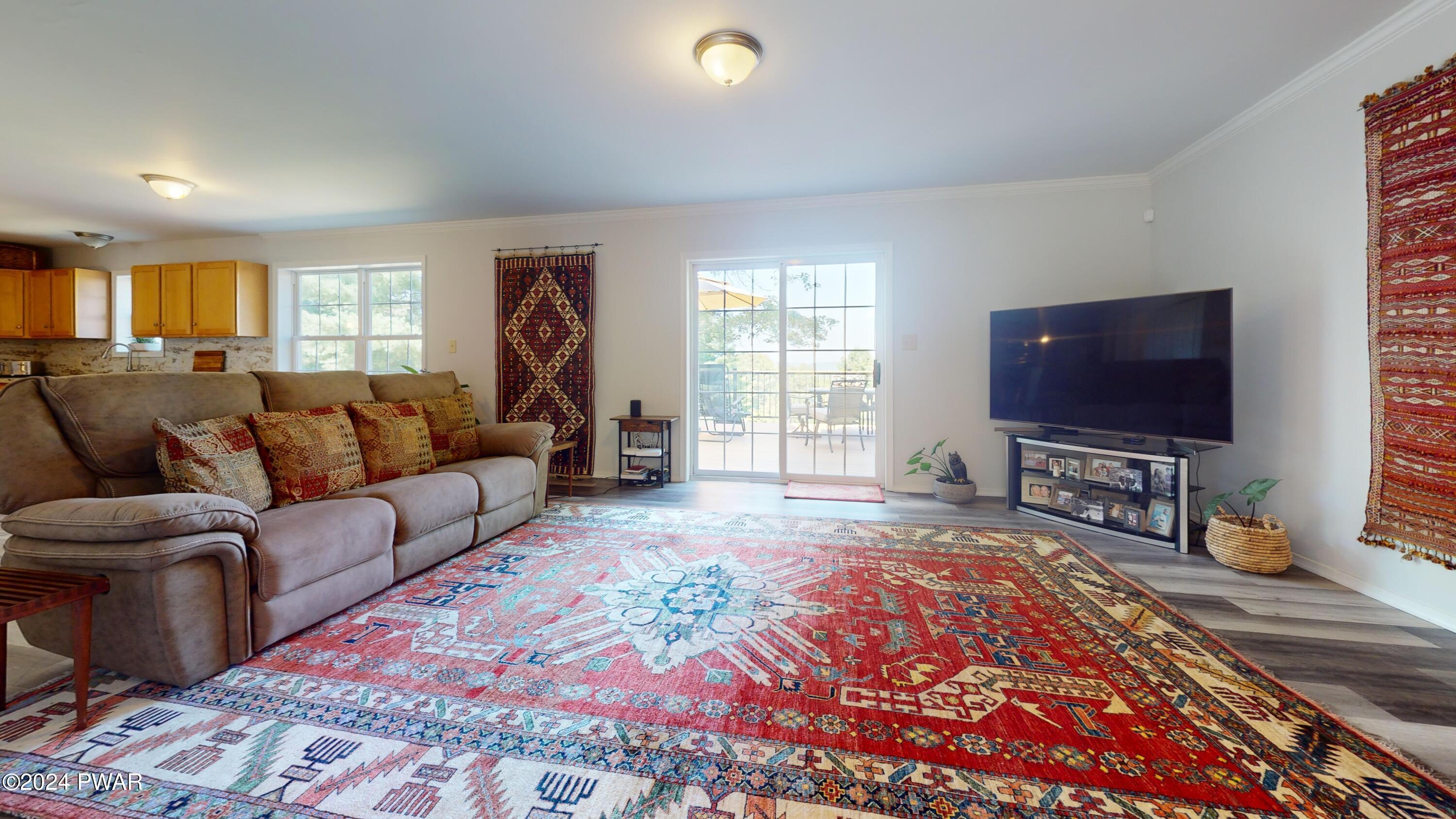 115 Mountain View Road Greeley, PA 18425 - Photo 19 of 68 Living room w/ slider to deck
