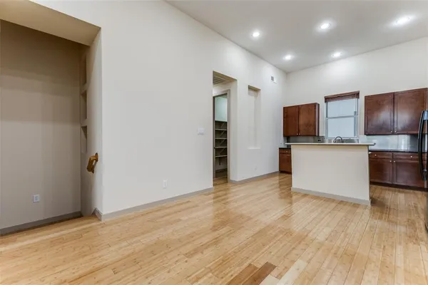 an empty room with a balcony