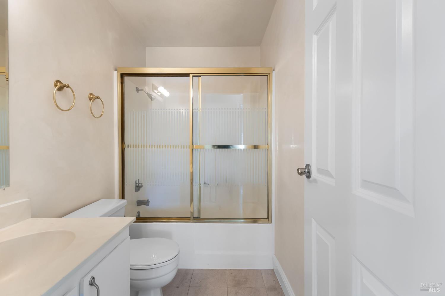 2177 Vista Del Rancho Fairfield, CA 94534 - Photo 13 of 28 a bathroom with a granite countertop sink a toilet and shower