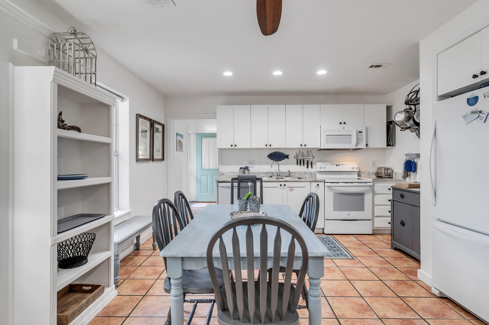 44 Vicki Street Santa Rosa Beach, FL 32459 - Photo 11 of 41 a kitchen with stainless steel appliances granite countertop a stove a sink dishwasher a refrigerator with a dining table and chairs