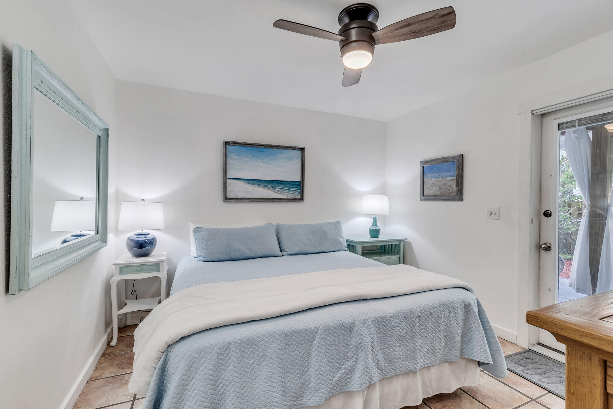 44 Vicki Street Santa Rosa Beach, FL 32459 - Photo 19 of 41 a bedroom with a bed and a chandelier