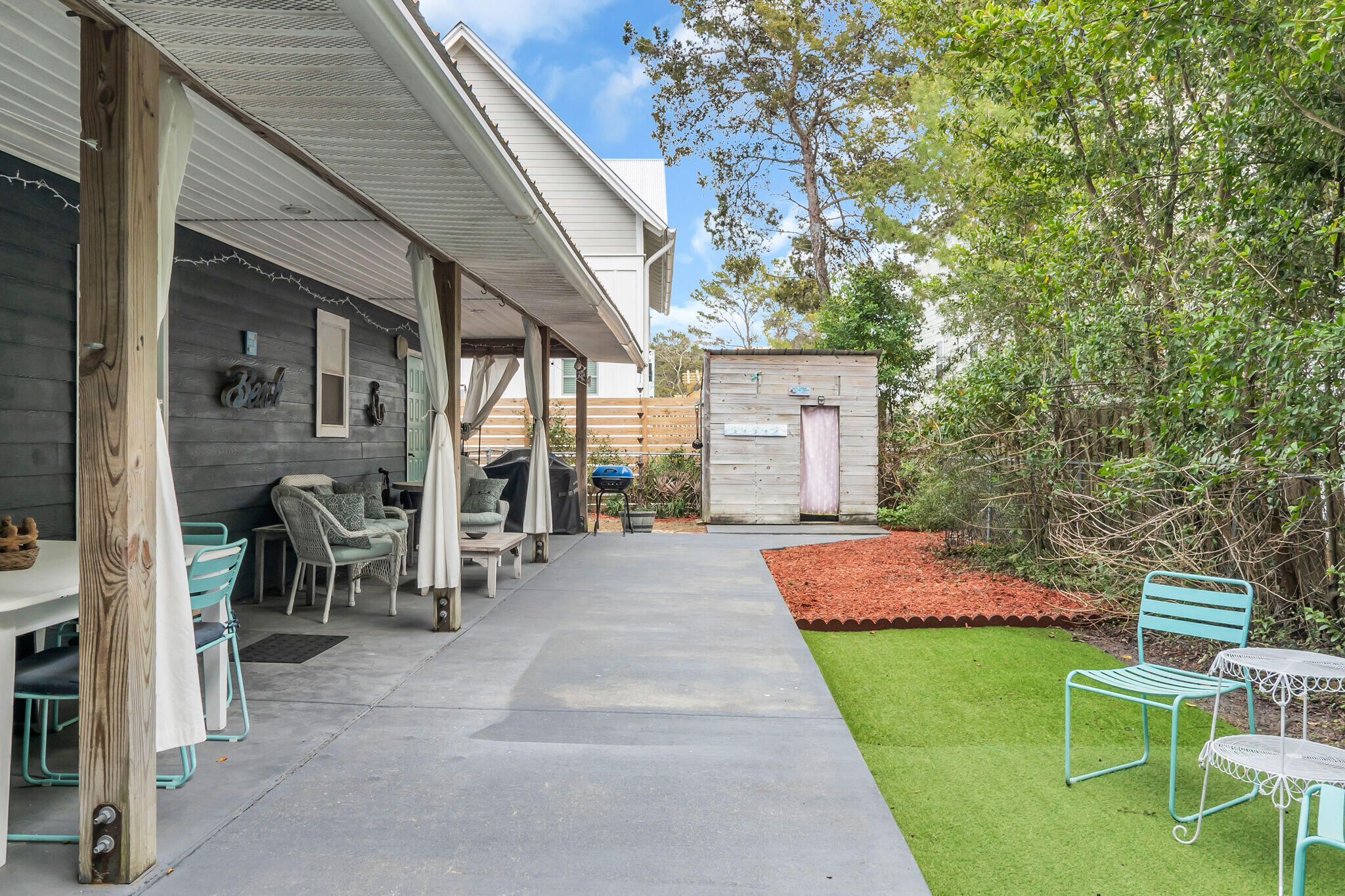 44 Vicki Street Santa Rosa Beach, FL 32459 - Photo 29 of 41 a front view of a house with a yard chairs and table