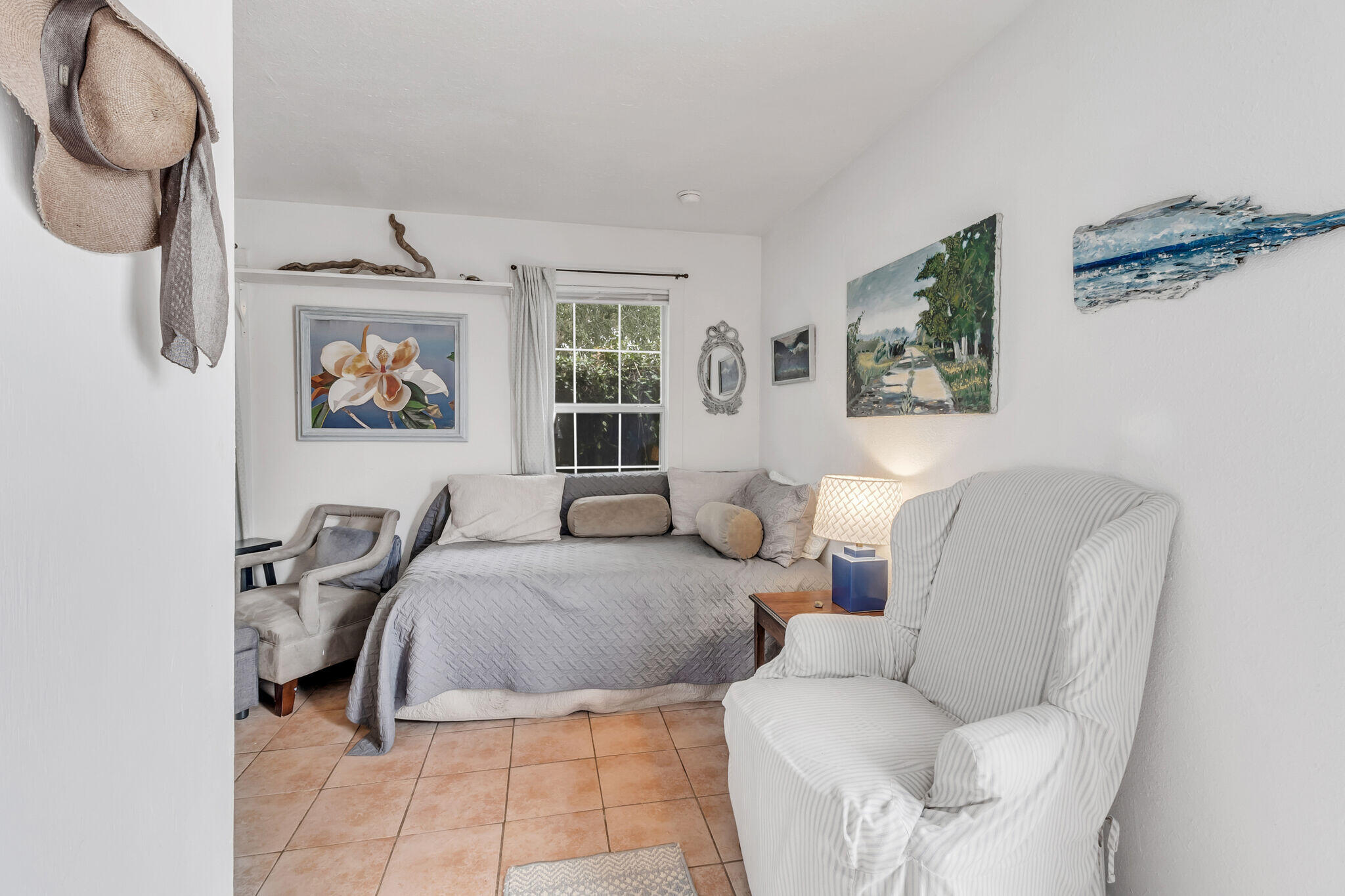 44 Vicki Street Santa Rosa Beach, FL 32459 - Photo 31 of 41 a spacious bedroom with a bed a mirror and windows