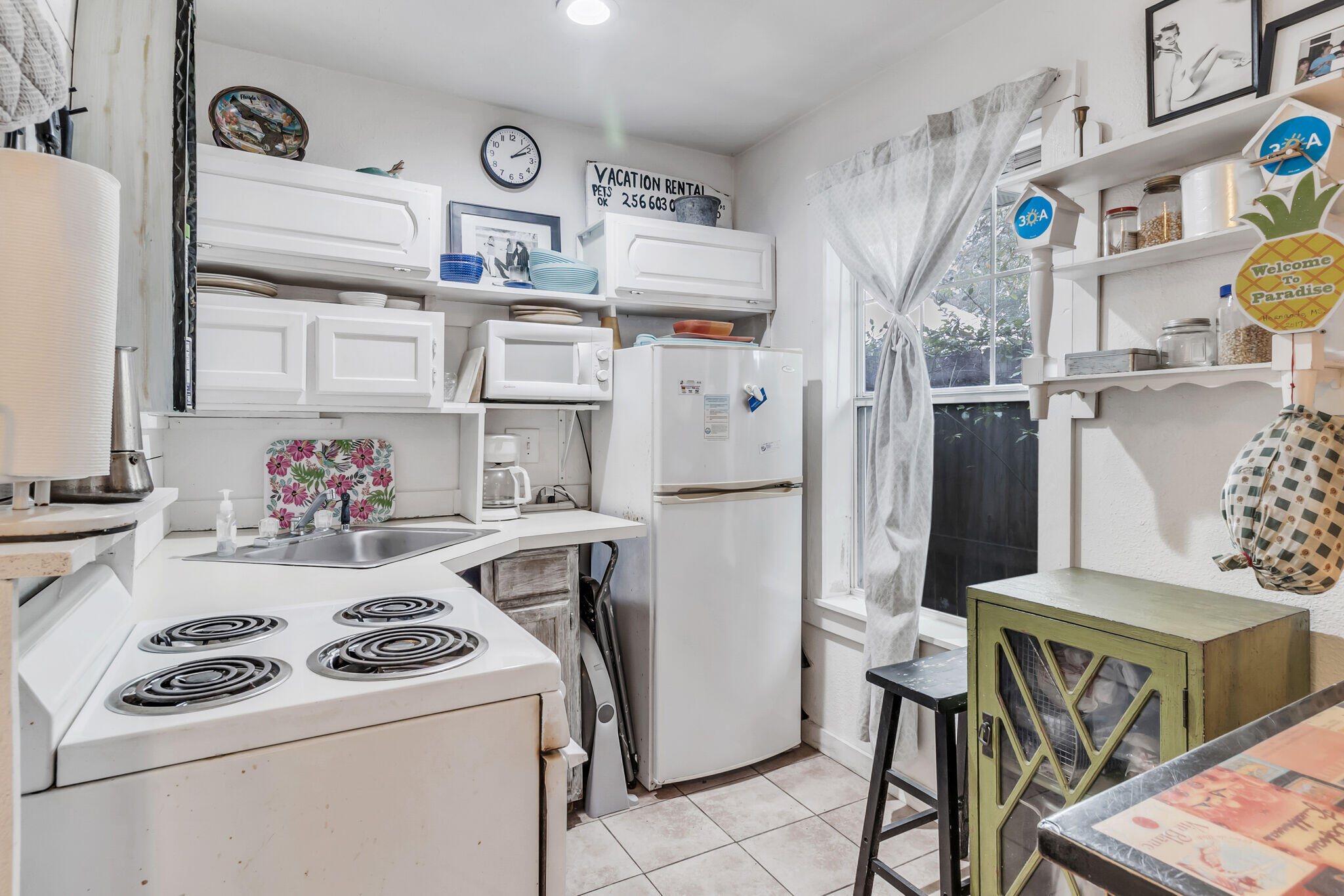 44 Vicki Street Santa Rosa Beach, FL 32459 - Photo 34 of 41 a kitchen with a refrigerator and a stove