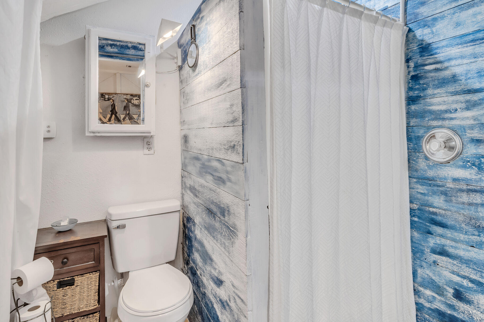 44 Vicki Street Santa Rosa Beach, FL 32459 - Photo 36 of 41 a white toilet sitting next to a shower curtain