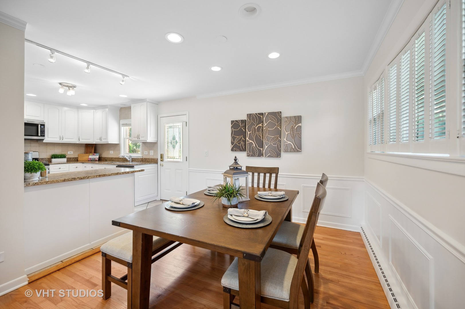 740 Juniper Road Glenview, IL 60025 - Photo 6 of 22 a view of a dining room with furniture and wooden floor