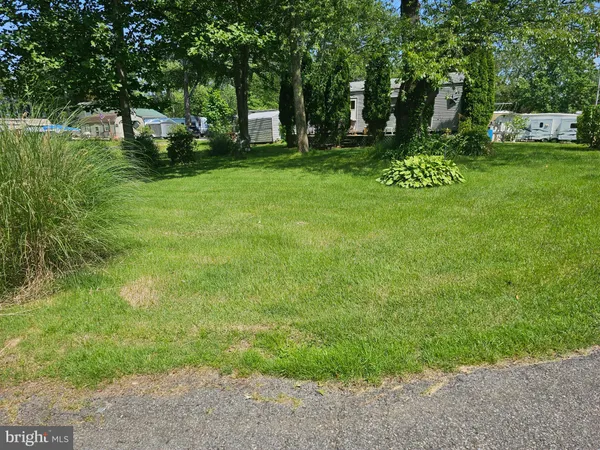 a view of backyard with green space