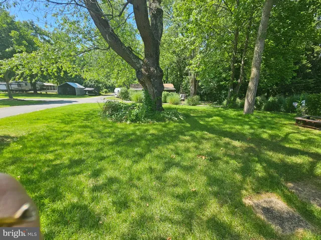 a view of outdoor space with deck and green space
