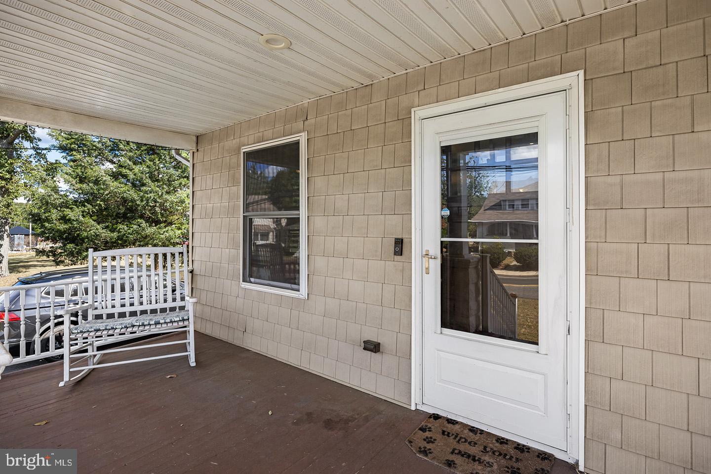 2 Cedarbrook Road Sicklerville, NJ 08081 - Photo 4 of 28 a view of a porch with a bench