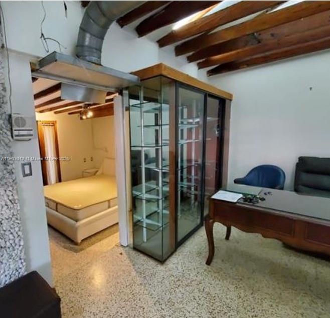 6918 Northeast 5th Avenue Miami, FL 33138 - Photo 5 of 9 a living room with furniture a flat screen tv and a table