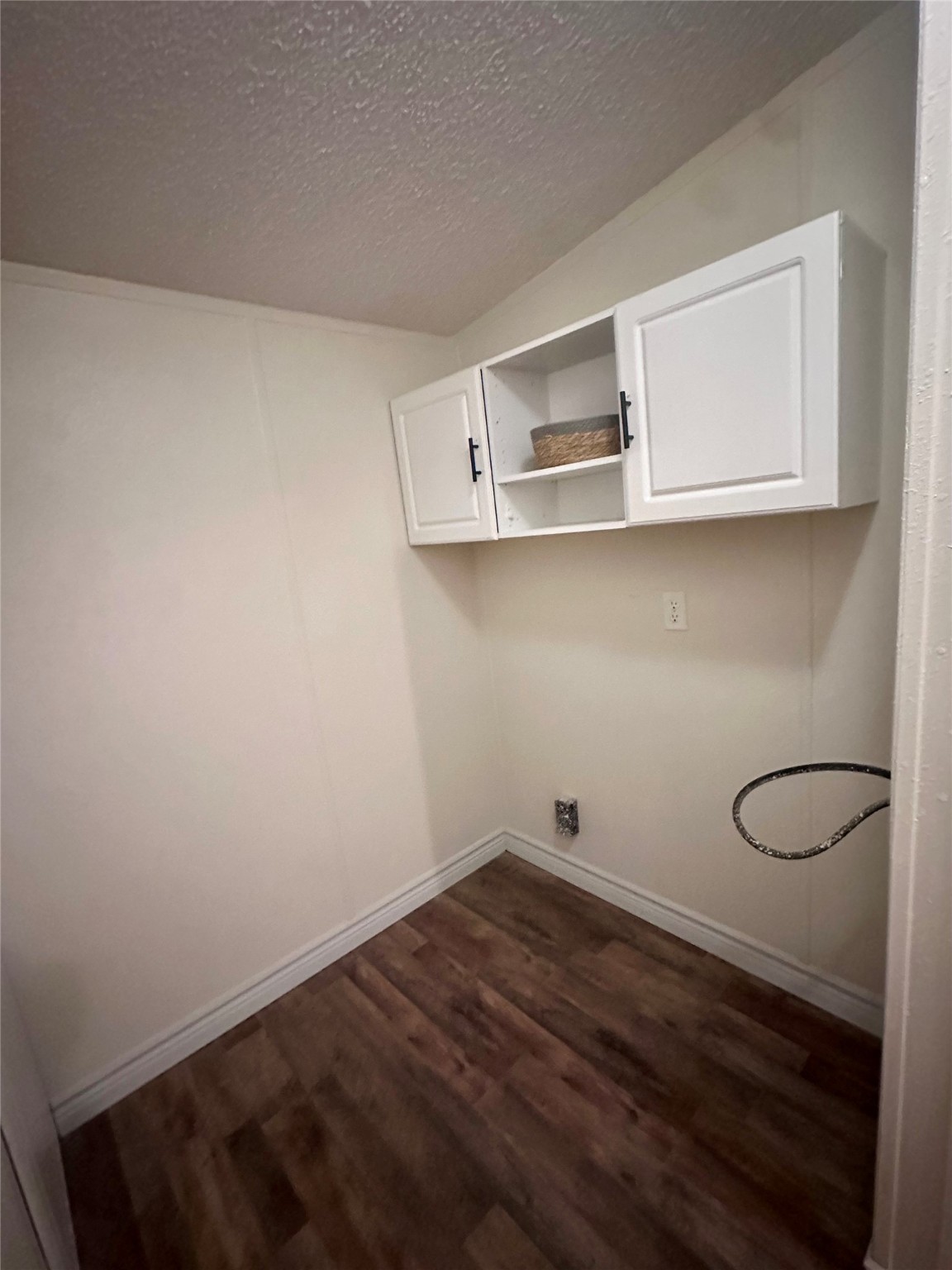 13630 FM 361 Road, Unit B Needville, TX 77461 - Photo 12 of 12 a view of a room with rack on the wall