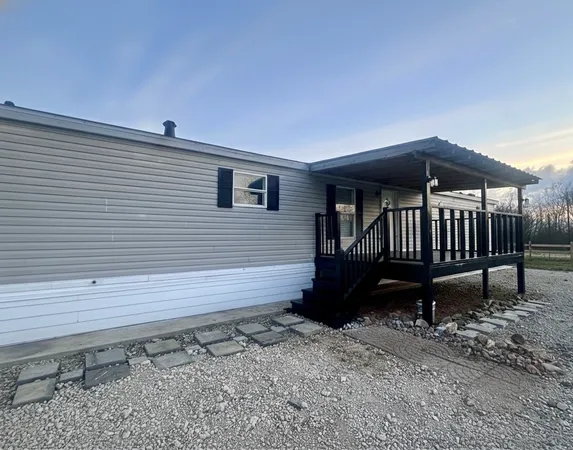a view of a deck with a bench and wooden floor