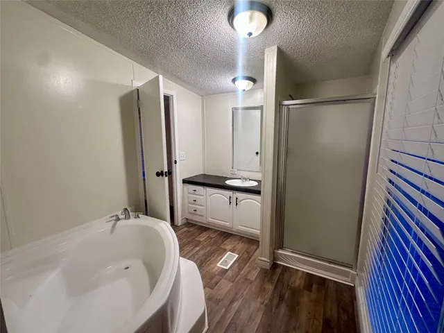 a bathroom with a bathtub and a sink
