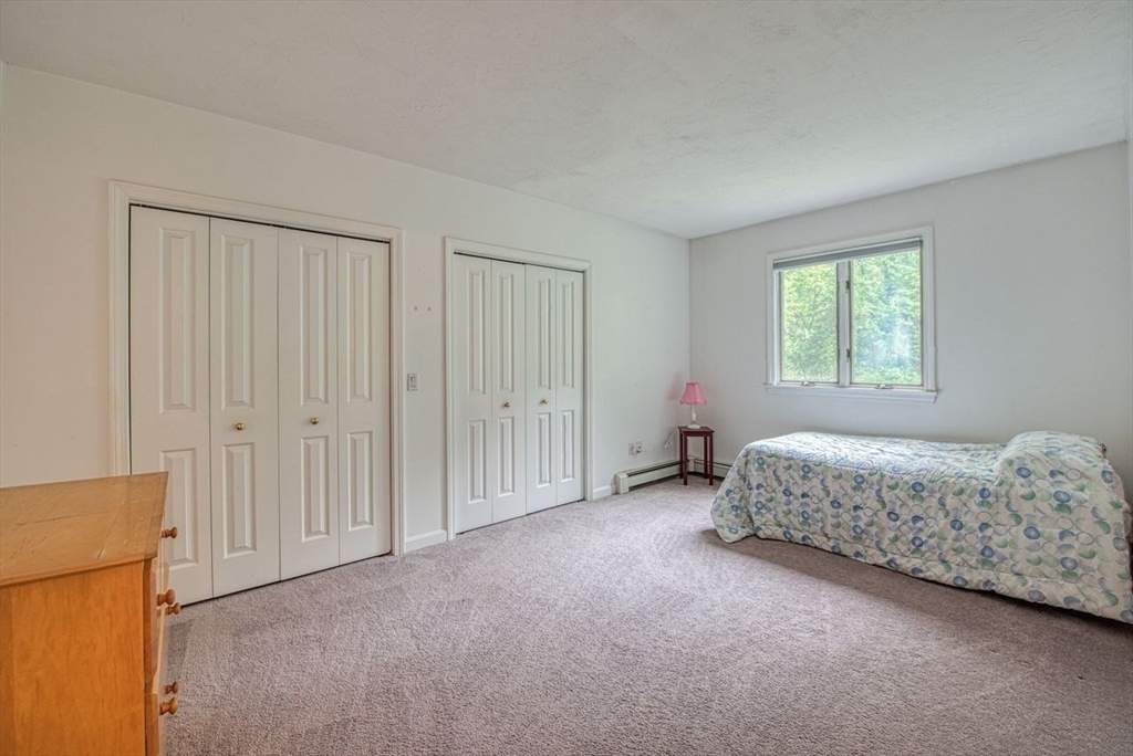 7 Tisdale Road Sharon, MA 02067 - Photo 24 of 37 a spacious bedroom with a bed and a window