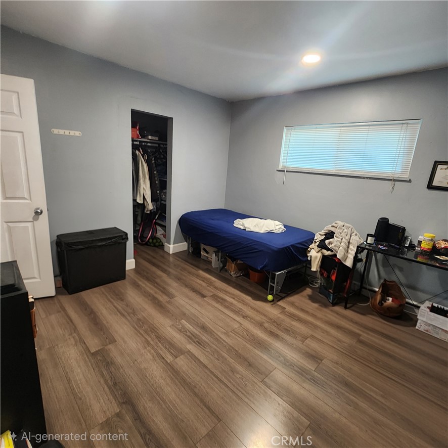3076 Ronald Street Riverside, CA 92506 - Photo 13 of 19 a bedroom with furniture and a wooden floor