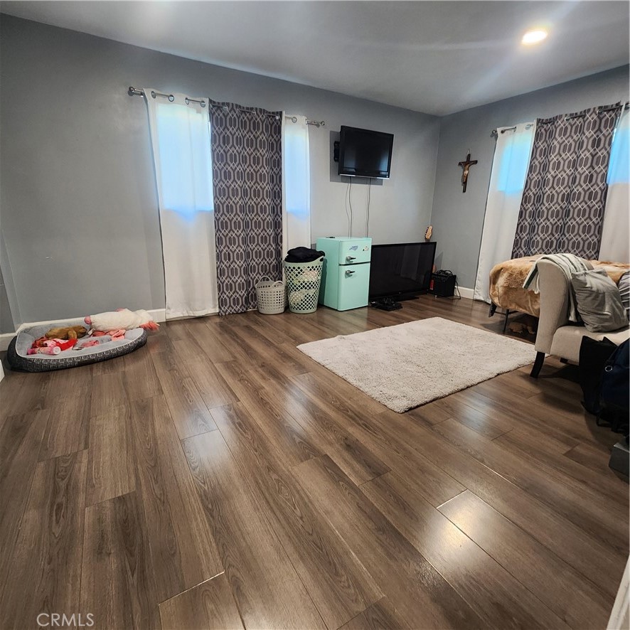 3076 Ronald Street Riverside, CA 92506 - Photo 14 of 17 a bedroom with a bed and a flat screen tv